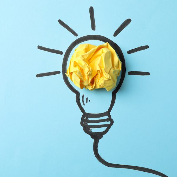 Drawn light bulb on blue background. Good idea concept